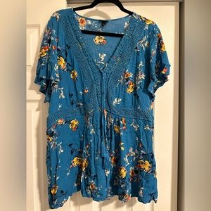 Blue floral shirt tie on front